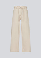 Jeans in Summer Sand with wide legs in a cotton denim. IsoldeMD solid pants has a high waist, front and back pockets and a tie band at the waist.