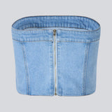 Short denim top in a corset design. IvannaMD top in made in light colored denim and is closed with a zipper at the back.