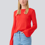 Knitted top with long flared sleeves and a wide neckline. IvonneMD o-neck has a normal fit.