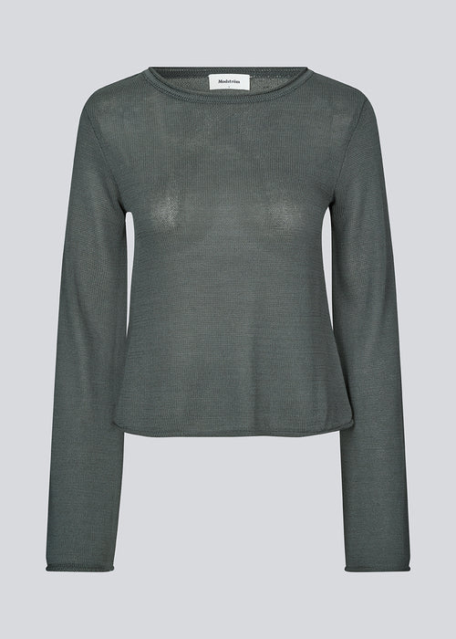 Knitted top with long flared sleeves and a wide neckline. IvonneMD o-neck has a normal fit.