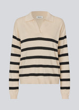 Soft knit/blouse with a v-neckline and a shirt collar. IvoryMD v-neck has ribbed edges at the bottom and sleeves. The knit is beige with black stripes.&nbsp;