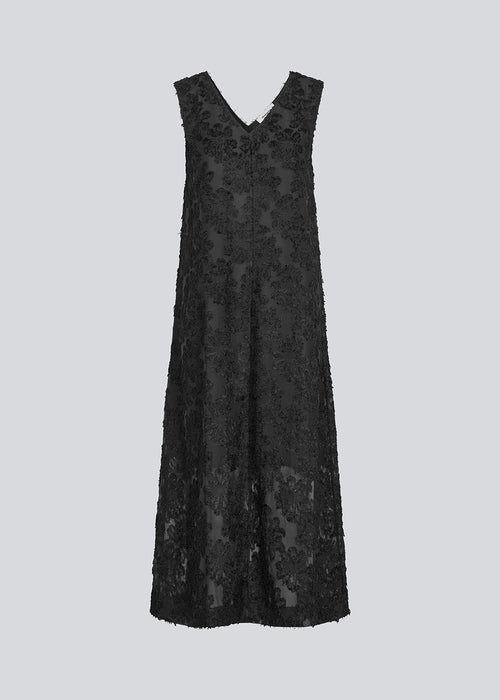 Sleeveless black dress in a slightly see-through material with lining. IvyMD dress has a loose fit and a V-neckline.