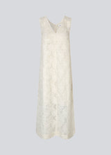 Sleeveless beige dress in a slightly see-through material with lining. IvyMD dress has a loose fit and a V-neckline.