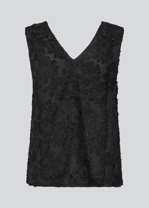 Sleeveless top in black in a slightly see through material with lining. IvyMD top has a loose fit and a V-neckline.