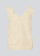 Sleeveless top in creme in a slightly see through material with lining. IvyMD top has a loose fit and a V-neckline.