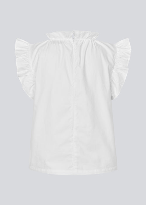 Loose white top with a ruffle detail at the sleeves and neck. IzakMD top is sleeveless and has a hidden zipper in the back. The model is 177 cm and wears a size S/36.