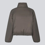 Slightly cropped brown puffer with a high neck. JoniMD jacket has side pockets, elastic at the sleeves and an adjustable string at the hem.