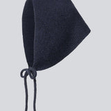 Josefine Vogt – bonnet &amp; gloves. Josefinemd bonnet and gloves set is a stylish and practical duo made from recycled materials, perfect for cold days. The fingerless gloves and matching bonnet come in an elegant pouch with drawstring and logo.
