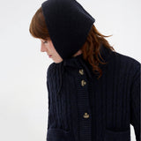 Josefine Vogt – bonnet &amp; gloves. Josefinemd bonnet and gloves set is a stylish and practical duo made from recycled materials, perfect for cold days. The fingerless gloves and matching bonnet come in an elegant pouch with drawstring and logo.
