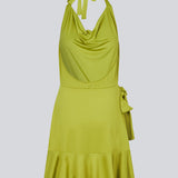 Short dress with a draped halterneck neckline and a slim tie band at the neck. JosefineMD flowy dress has a deep opening in the back, wrap detail in the front, and a ruffled hem. Josefine is 165 cm an