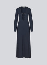 Fitted ankle-length dress with long sleeves in a soft jersey material. JosefineMD long dress has a deep neckline in front with ring detail. The skirt has slits on both sides. The model is 165 cm and wears a size S/36.