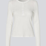 White fitted long-sleeve pointelle t-shirt. Josefinemd LS t-shirt is crafted in pointelle cotton with lace trim. The feminine cut and subtle openwork pattern give this classic style an elegant touch. Josefine Vogt (165 cm) and the model (177 cm) are both wearing size Small.