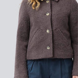Short jacket in a wool mix. JustyMD short jacket has a loose fit, button closure and to pockets in front.