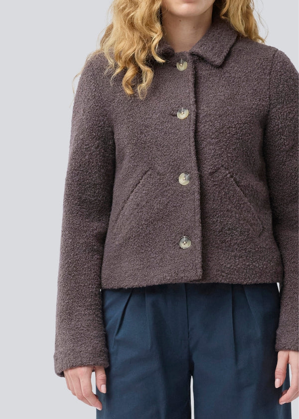 Short jacket in a wool mix. JustyMD short jacket has a loose fit, button closure and to pockets in front.