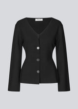 Flat knitted cardigan with a V-neck in black. KaitoMD cardigan is fitted and has long wide sleeves with a folded detail.