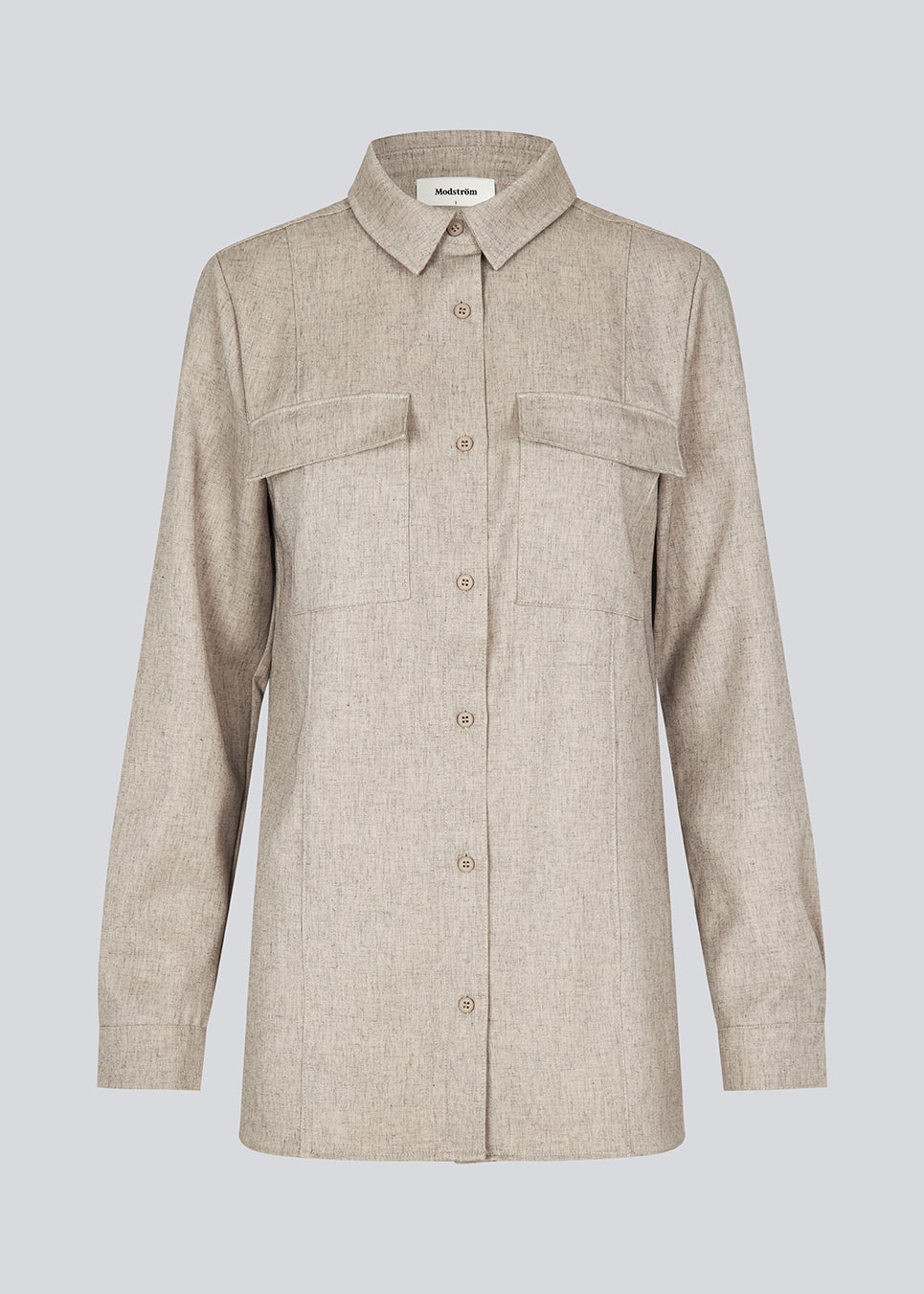 Beige long shirt with folded details in front. KalemMD shirt has two chest pockets, button closure in front and slits in the side seams.