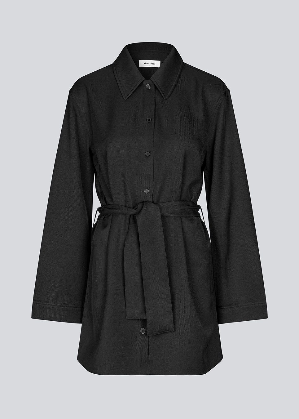 Shirtdress in black with tieband in the waist. KammyMD dress has a collar, button closure in front and belt loops.