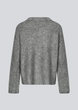 Soft knit in dark grey with a v-neck. KaneMD v-neck has a loose fit and dropped shoulders.