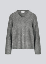 Soft knit in dark grey with a v-neck. KaneMD v-neck has a loose fit and dropped shoulders.
