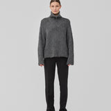 Soft grey knit with a high neck and half zip front. KaneMD v-neck has a loose fit and dropped shoulders.