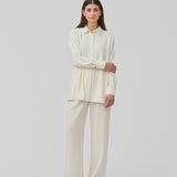 Loose shirt with collar and button closure. KarterMD shirt has loose sleeves with cuff and button closure.
