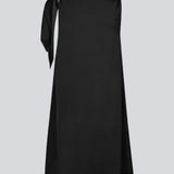 Midi satin dress with waterfall detail at the neck in black. KatjaMD dress has a tie detail at the shoulder and a relaxed fit.