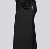 Midi satin dress with waterfall detail at the neck in black. KatjaMD dress has a tie detail at the shoulder and a relaxed fit.&nbsp;