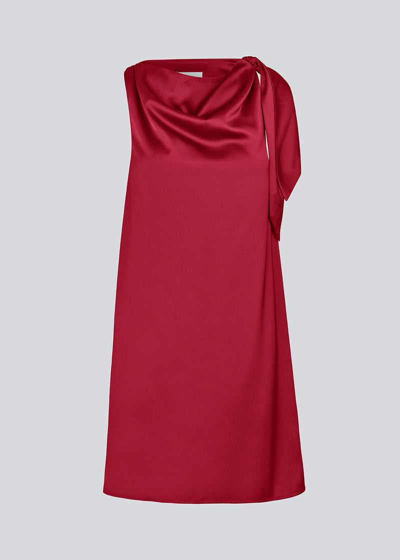 Midi satin dress with waterfall detail at the neck. KatjaMD dress has a tie detail at the shoulder and a relaxed fit.
 