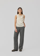 Satin top with waterfall detail at the neck. Katja MD top has a tie detail at the shoulder and a relaxed fit.