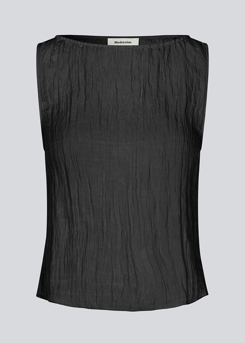 Sleeveless top in a structured material. KevinMD top in Black has a round neck and is slightly cropped.