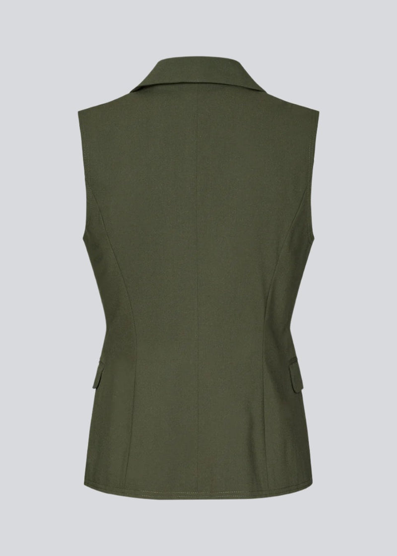 Fitted green vest with lining. KimanaMD vest has a blazer collar and two pocket in front.