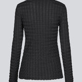 Black top with long sleeves in structured jersey. KimoraMD LS top is fitted and has a high neck. The model is 175 cm and wears a size S/36.
