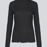 Black top with long sleeves in structured jersey. KimoraMD LS top is fitted and has a high neck. The model is 175 cm and wears a size S/36.