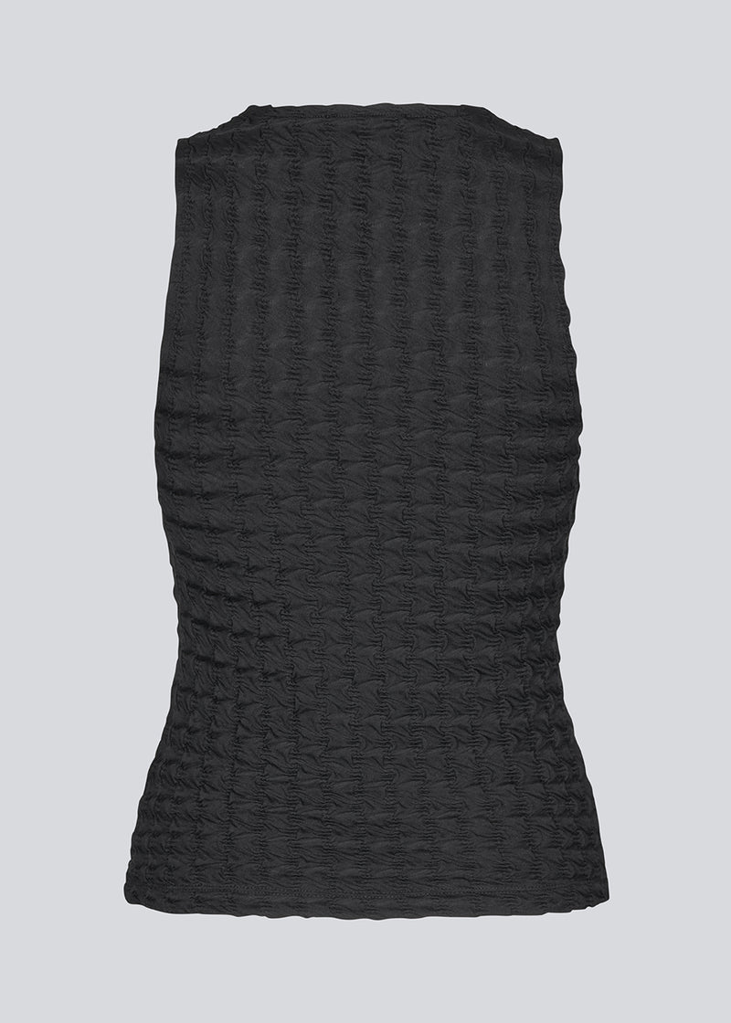 Black sleeveless top in a structured jersey. kimoramD top is fitted and has a round neckline.