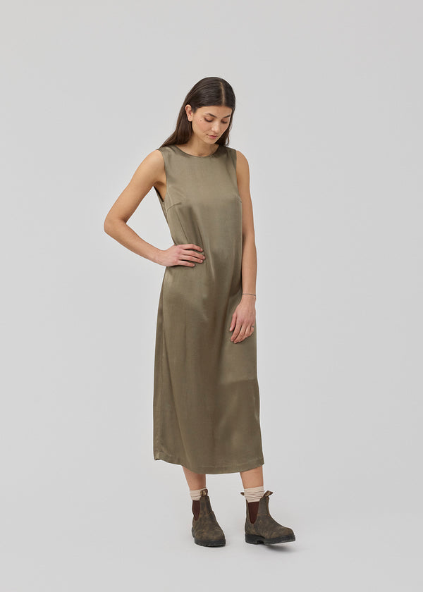 Maxi dress in brown with a loose fit in satin. KindleMD dress has a deep back cut and a classic A-line.