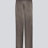 Loose pants in brown with wide legs in satin. KindleMD pants have side pockets and an invisible zipper on the side.