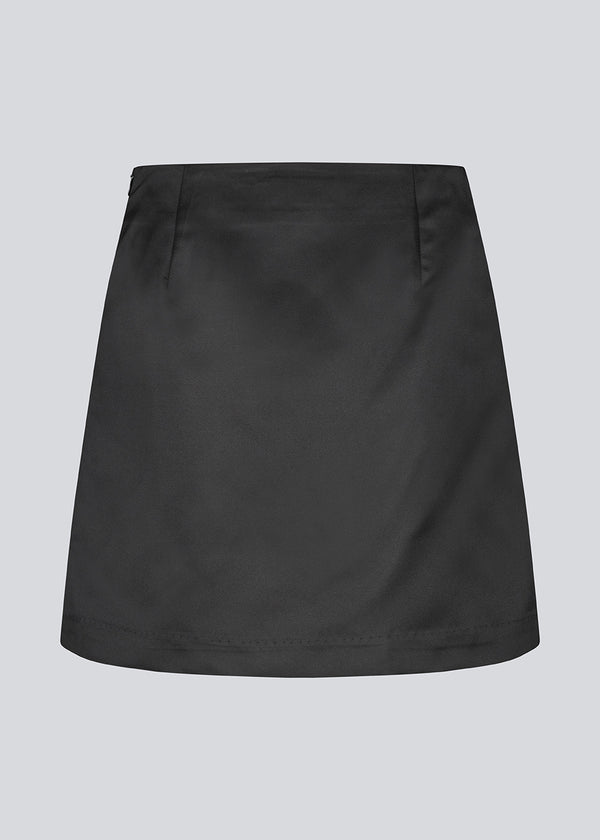 Classic black mini skirt in an A-line. KleoMD skirt has an invisible zipper, medium high waist and lining.