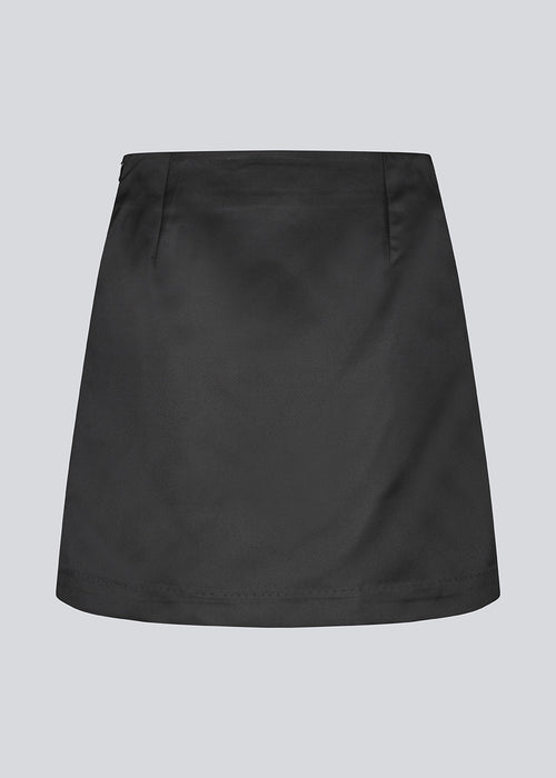 Classic black mini skirt in an A-line. KleoMD skirt has an invisible zipper, medium high waist and lining.