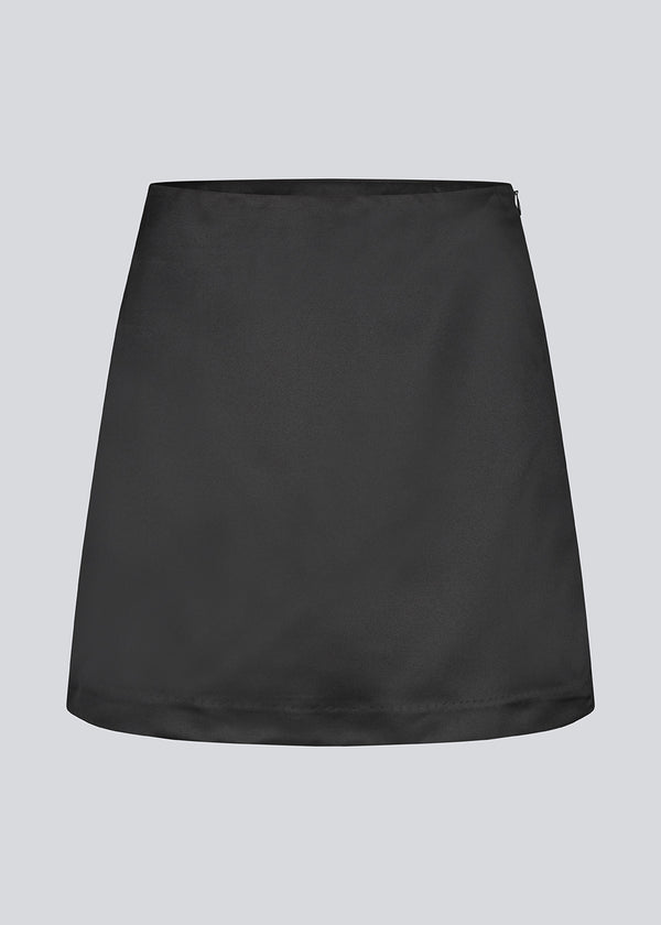 Classic black mini skirt in an A-line. KleoMD skirt has an invisible zipper, medium high waist and lining.