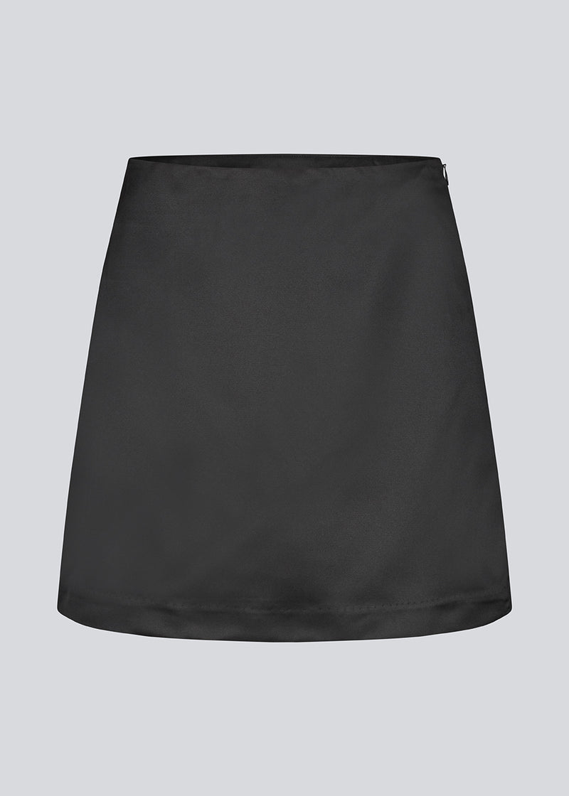 Classic black mini skirt in an A-line. KleoMD skirt has an invisible zipper, medium high waist and lining.