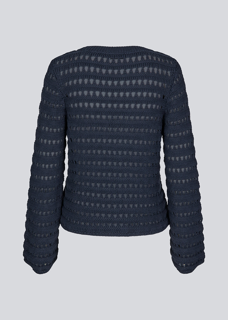 Slightly see through knit in navy sky with a hole pattern. KolbyMD o-neck has a relaxed fit and loose sleeve.