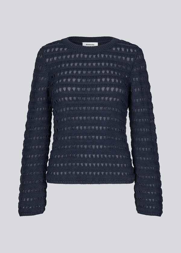 Slightly see through knit in navy sky with a hole pattern. KolbyMD o-neck has a relaxed fit and loose sleeve.