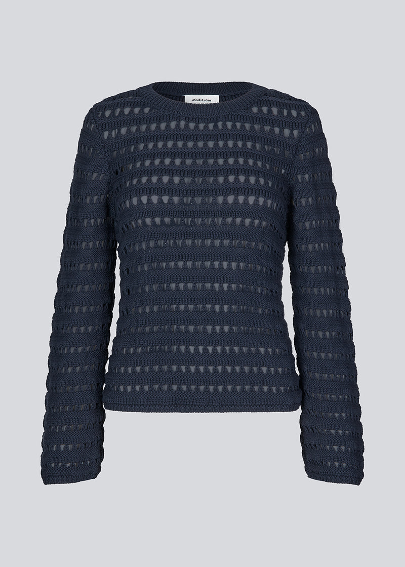 Slightly see through knit in navy sky with a hole pattern. KolbyMD o-neck has a relaxed fit and loose sleeve.