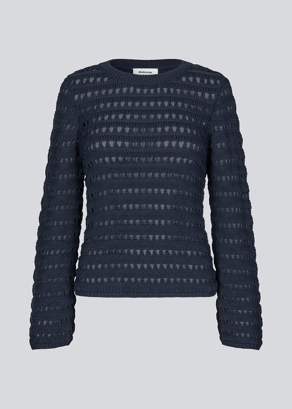 Slightly see through knit in navy sky with a hole pattern. KolbyMD o-neck has a relaxed fit and loose sleeve.