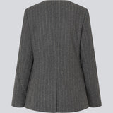 Fitted dark grey blazer in a pinstriped wool mix. KristolMD blazer has shoulder pads, two pockets in front, lining and a slit in the back.