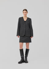 Short dark grey skirt in a pinstriped wool mix. KristolMD skirt has lining and an invisible zipper in the side.