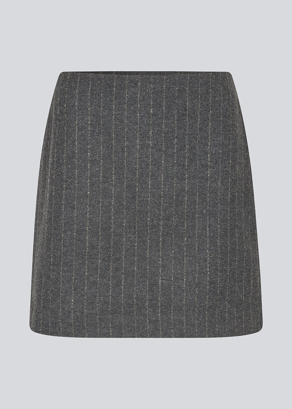 Short dark grey skirt in a pinstriped wool mix. KristolMD skirt has lining and an invisible zipper in the side.