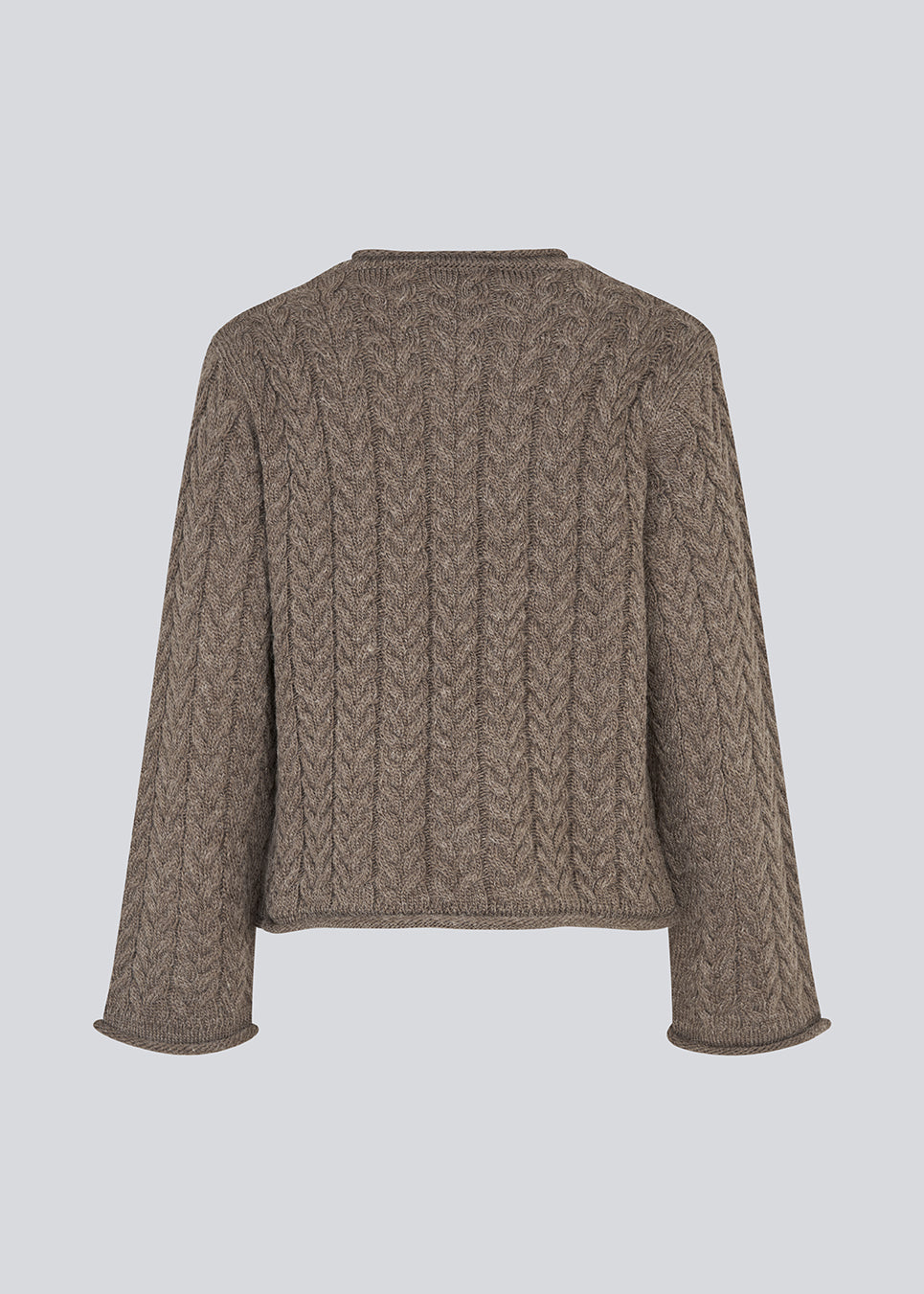 Loose knit with wide sleeves in cable knit. KurtisMD round neckline and rolled edges.