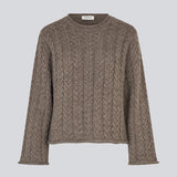 Loose knit with wide sleeves in cable knit. KurtisMD round neckline and rolled edges.