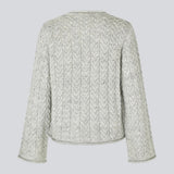 Loose grey wool knit with wide sleeves in cable knit. KurtisMD o-neck has a round neckline and rolled edges.